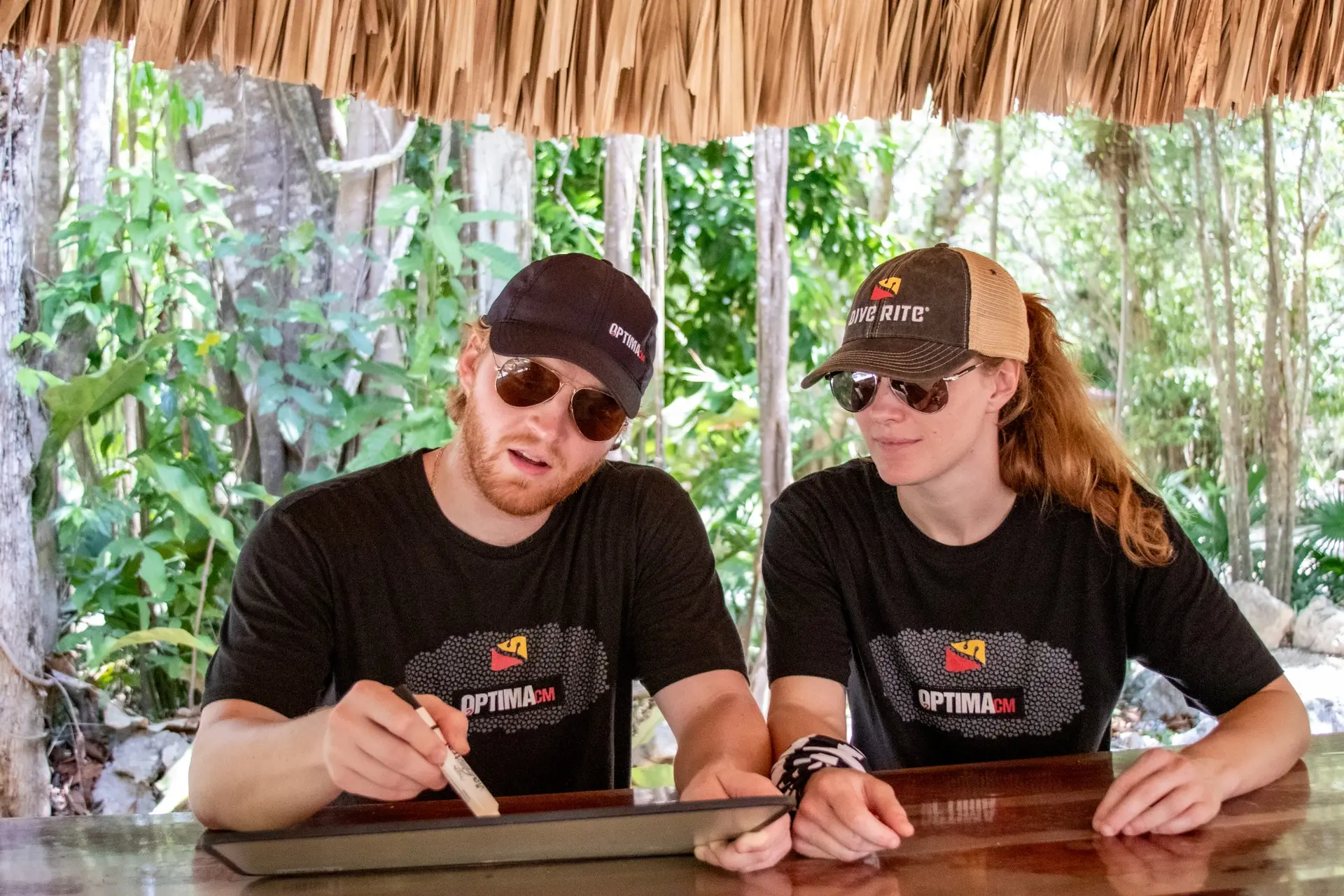 Instructor and student reviewing a dive plan